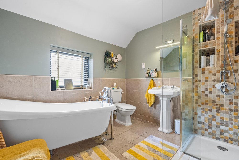 Bathroom with a freestanding bath and colourful styling