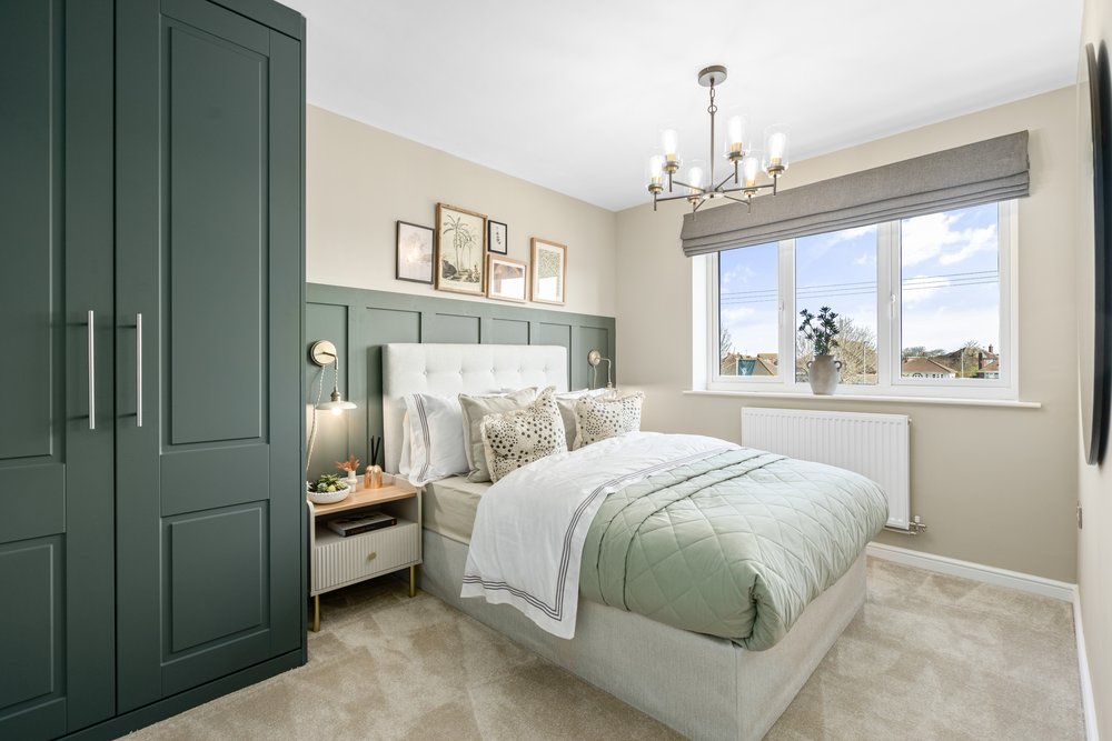 Show home bedroom with green styling